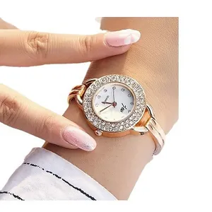 Elegant rose gold women's quartz watch featuring a sparkling rhinestone bezel and bracelet band