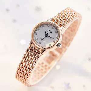 Elegant rose gold women's watch with rhinestone indices and white dial in a gift setting