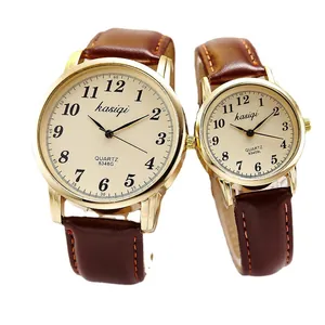 Classic gold quartz couple watches with brown leather straps and champagne dials
