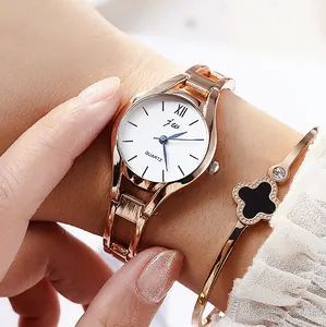Elegant rose gold watch with white dial and matching clover bracelet set for women