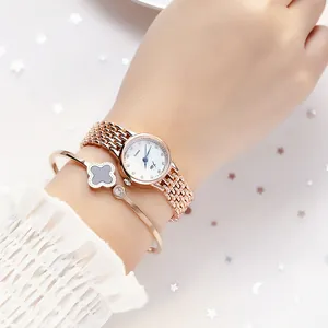 Elegant rose gold women's watch with steel mesh band and matching clover bracelet set