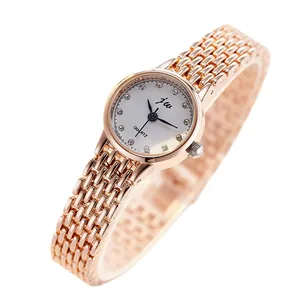 Elegant rose gold women's quartz watch with rhinestone markers and a metal chain strap