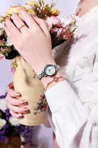Elegant women's silver watch set with sparkling star bracelet and diamond ring detail