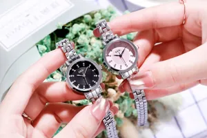 Close-up of stylish ladies quartz watch with diamond markers and silver steel band