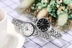 Close-up of elegant ladies' waterproof watches with rhinestone bezel and steel band