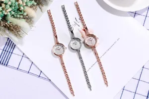 Detail showing elegant rose gold and silver link chain watches with glitter dial