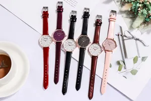 Flat lay of colorful women's starry sky watches with leather straps and rose gold cases