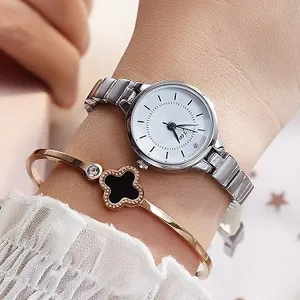 Silver quartz watch with rose gold clover bracelet set for women shown on wrist