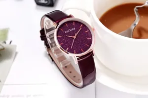 Detail of starry purple dial with rose gold case and glossy leather strap for women