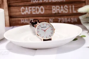 Detail of GoGoey watch with silver glitter dial and rose gold case on leather strap