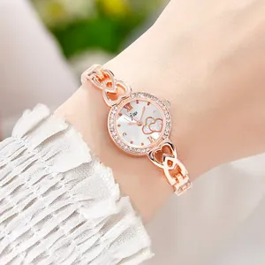 Damen-Armbanduhr in Roségold mit Strass-Lünette und Herz-Gliedern am Handgelenk