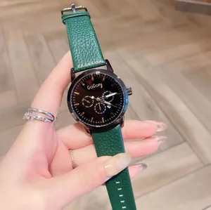 Detail of a GoGoey women's quartz watch with green leather strap and black multi-dial