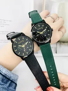 Close-up of stylish GoGoey quartz watches with black dials and textured leather straps