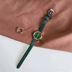Close-up of octagon green sunray dial and Roman numerals on ladies quartz watch