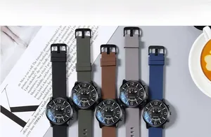 Flat lay of colorful minimalist watches with large dials on a lifestyle background