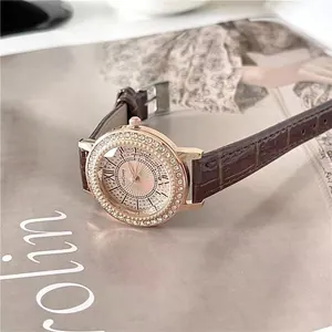 Elegant women's watch with sparkling crystal bezel and brown crocodile leather strap