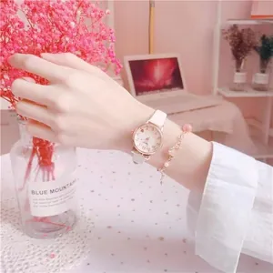 Elegant white leather quartz watch with heart dial and matching pearl bracelet set