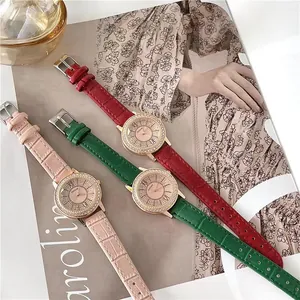 Close-up of stylish women quartz watches with rhinestone bezel and crocodile texture leather straps