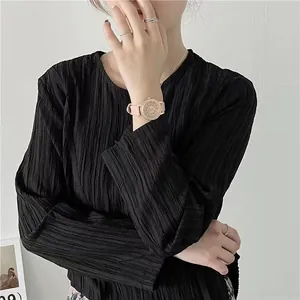 Close-up of sparkling starry dial watch with rose gold bezel on a model wrist