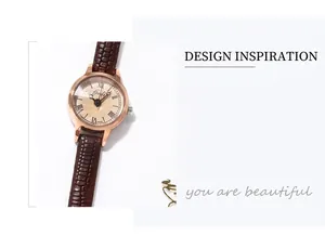 Détail macro de la montre rétro Gedi avec cadran champagne et bracelet en cuir brun
