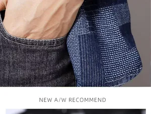 Detailed macro view of dark grey denim pocket and blue textured jacquard fabric sleeve