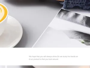 Close-up of minimalist white ceramic coffee cup with yellow drink on gray desk