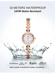 Vue détaillée de la montre à quartz en or rose avec chaîne cœur et étanchéité 3ATM splash