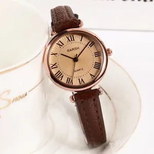 Elegant vintage small dial quartz watch with Roman numerals and brown leather strap