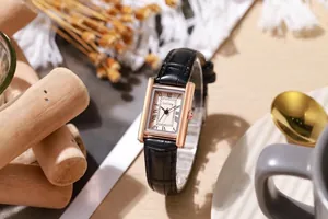 Macro detail of rectangle rose gold case with Roman numerals on vintage quartz watch