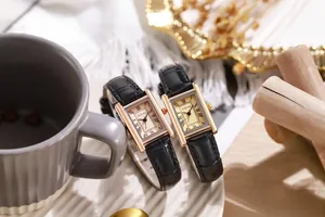Detailed macro view of vintage rectangular quartz watch faces with Roman numeral dials