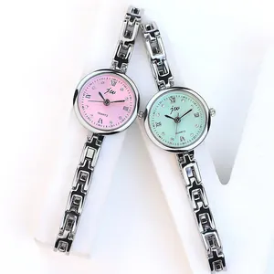Montre femme minimaliste avec bracelet en acier, cadrans à quartz rose et vert en argent poli