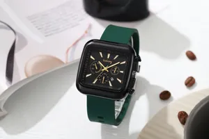 Close-up of a stylish square watch featuring a black dial and dark green silicone strap