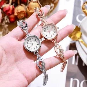 Orologio da donna elegante al quarzo con cinturino di strass in argento e oro rosa