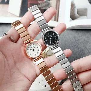 Montre quartz femme avec bracelet en acier, cadran rond et affichage de date en or et argent