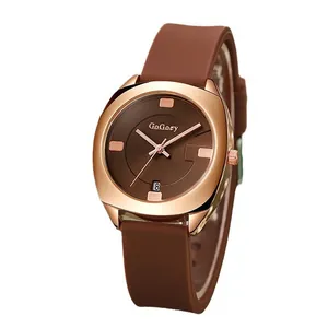 Minimalistisch quartzhorloge met bruine siliconen band en roségouden datumvenster