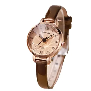 Elegant women's quartz watch with rose gold case and brown leather strap on white background