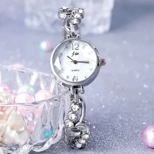 Detail of luxury women watch with silver metal band and sparkling crystal accents