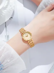 Close-up of GEDI ladies gold watch with rhinestone dial and elegant metal link bracelet
