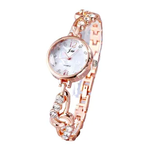 Elegant rose gold women watch with crystal bezel and white marble texture dial