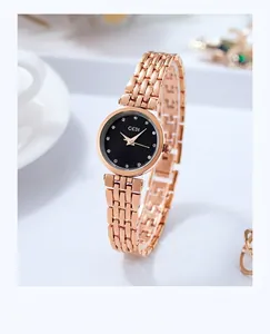 Detail of GEDI rose gold mesh strap watch with black dial and crystal markers