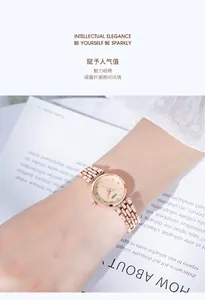 Close-up of rose gold fashion watch with crystal indices worn on a model's wrist