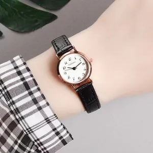 Elegant women's quartz watch with black leather strap and rose gold date display dial