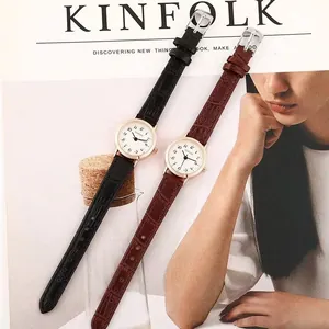 Detail of vintage ladies watches with faux crocodile leather straps and numeral dials