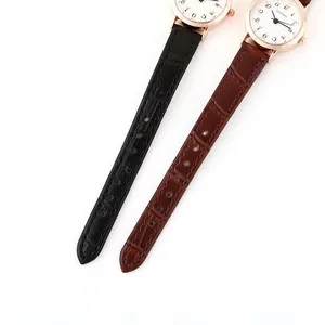 Detail of quartz watches with brown and black leather straps and rose gold cases