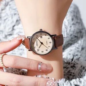 Montre quartz femme avec bracelet en cuir marron et cadran champagne à grands chiffres