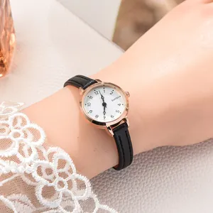 Close-up of elegant small dial women watch with rose gold case and black leather strap