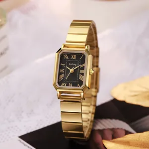 Macro view of a square gold watch with a black textured dial and Roman numerals
