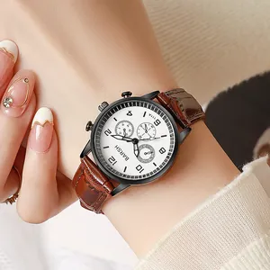 Close-up of stylish leather watch with triple sub-dials and brown crocodile texture strap