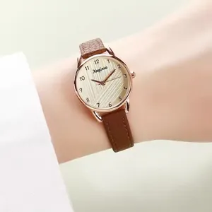 Elegant women's quartz watch with brown leather strap and rose gold textured dial