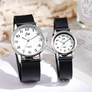 Detailed macro view of stylish couple quartz watches with silicone straps and large numbers